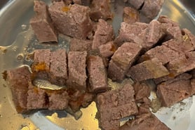 Close up of Edgard & Cooper Game & Duck wet food showing texture