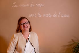 a woman in glasses and a white shirt