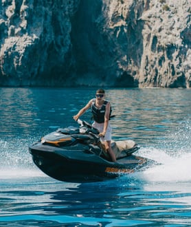 Tourist enjoying a guided jet ski tour along the Mallorca coast