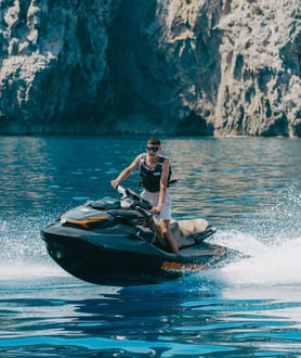 Tourist enjoying a guided jet ski tour along the Mallorca coast
