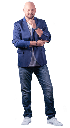 a bald bald man in a blue suit and white sneakers