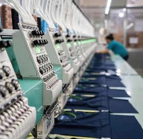 Close-up embroidery stitching on premium branded garments