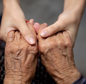 a woman holding her hands together in a hands