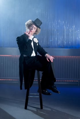a man in a tuxedo suit and a top hat