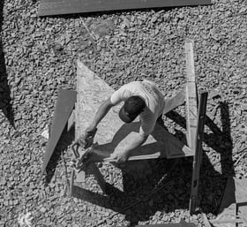 carpenter working with saw