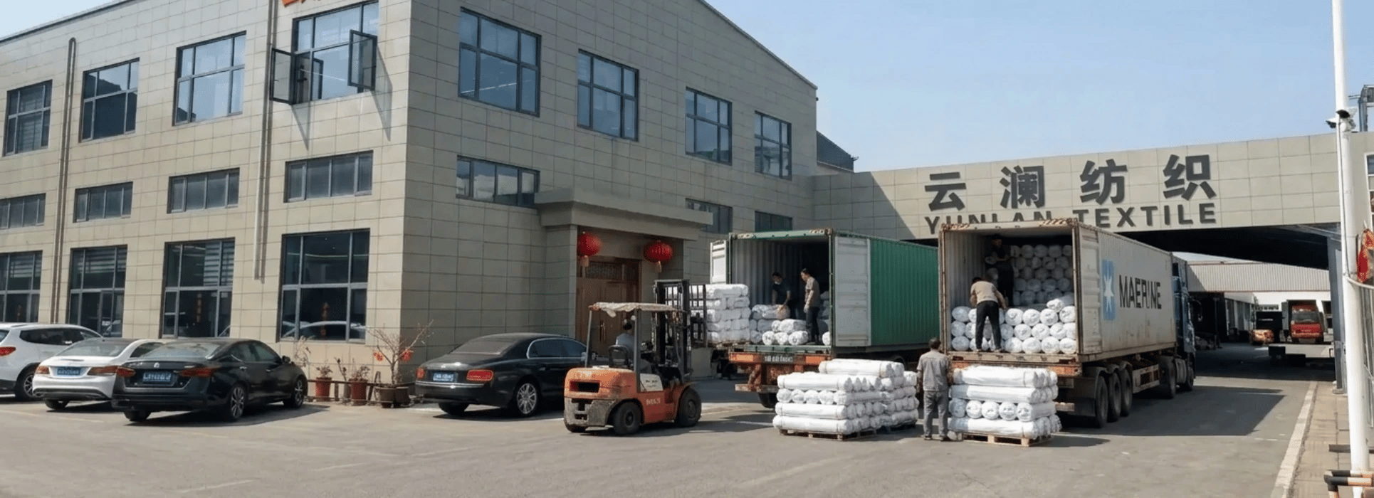 Textile factory loading fabric shipments at woven fabric manufacturer