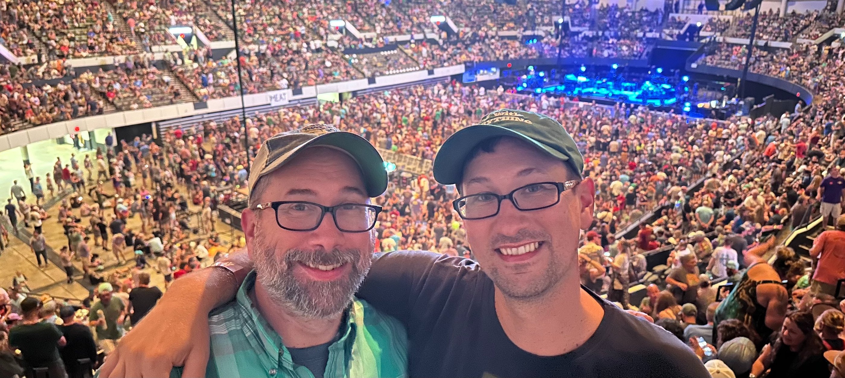 Mike and Chris Howdyshell in a large, crowded stadium