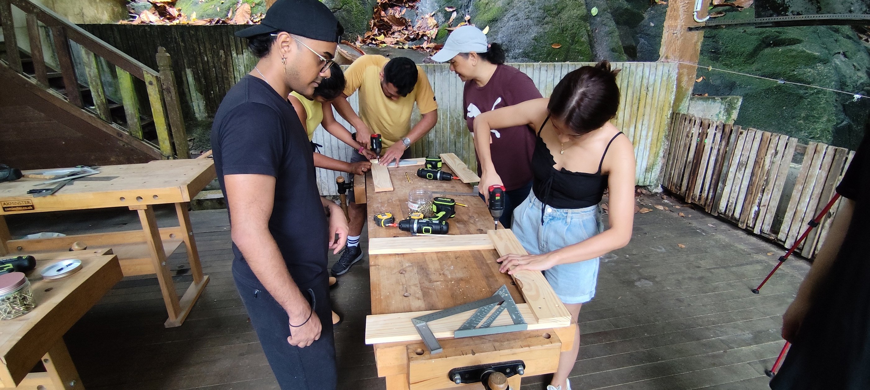 Group wood workshop making classroom furniture