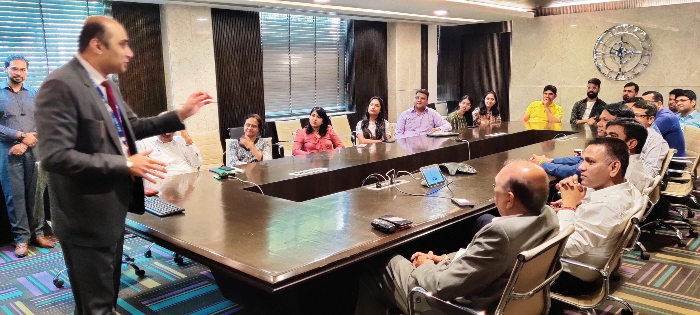 Dr. Prabal Frank Nandwani conducting corporate leadership training workshop in a large boardroom