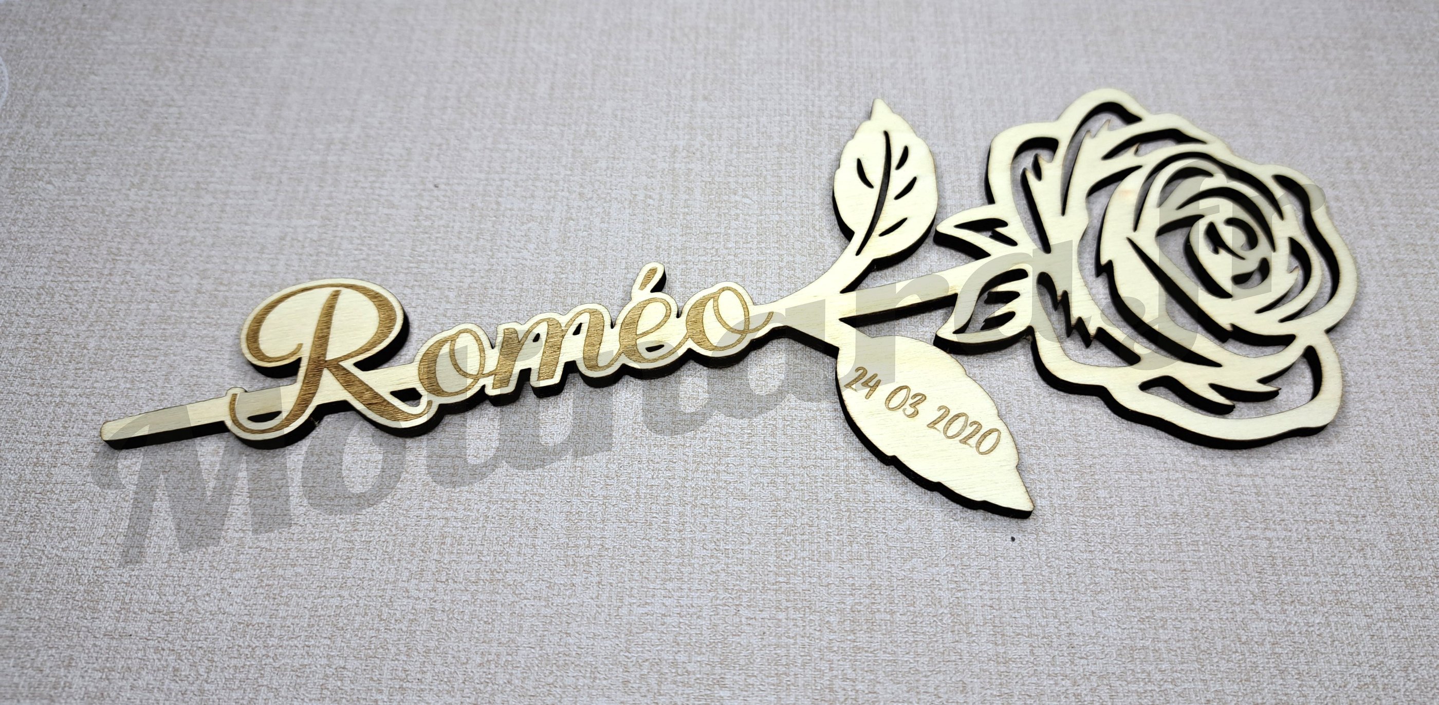 a rose shaped broocher with a rose on it