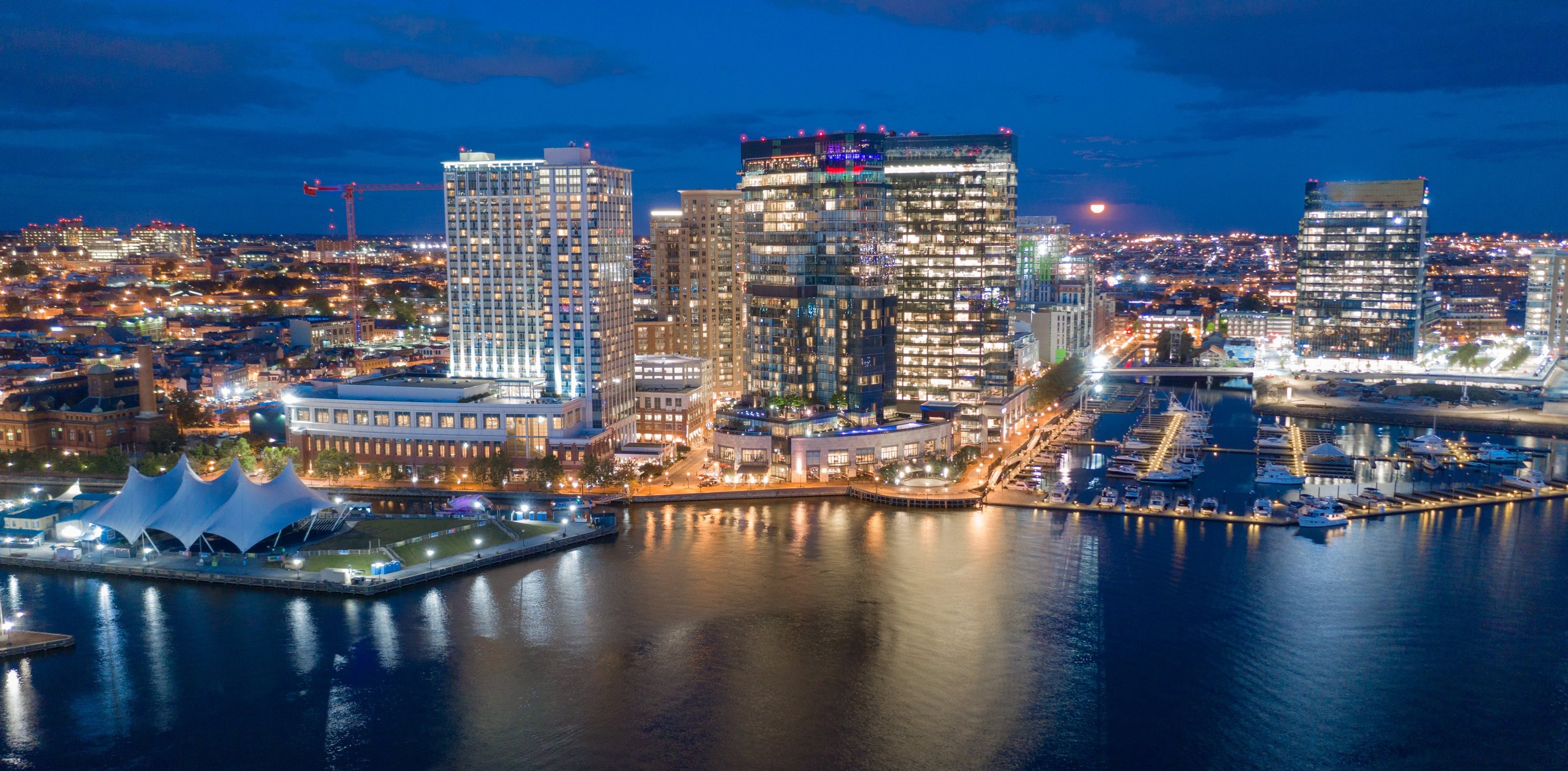 The buildings are illuminated in the downtown urban core of Baltimore Maryland