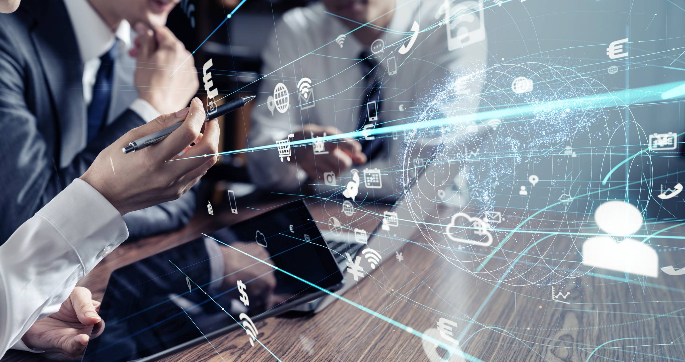 A man and a woman sitting with holograms of networks