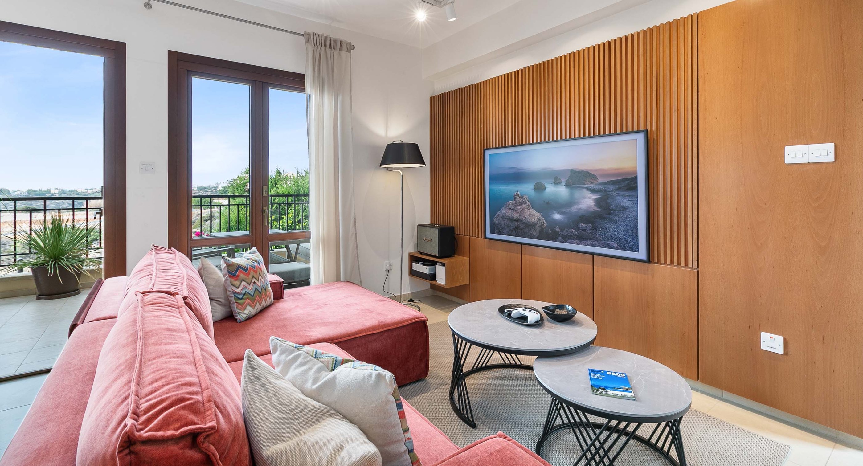 Sofa seating area with large TV and entertainment options at Theseus Retreat holiday rental in Cyprus