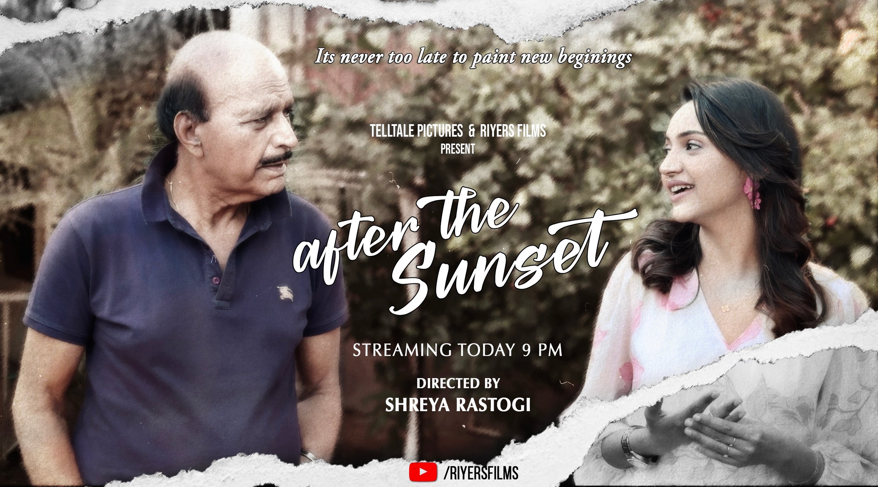 a man and woman standing in front of a tree