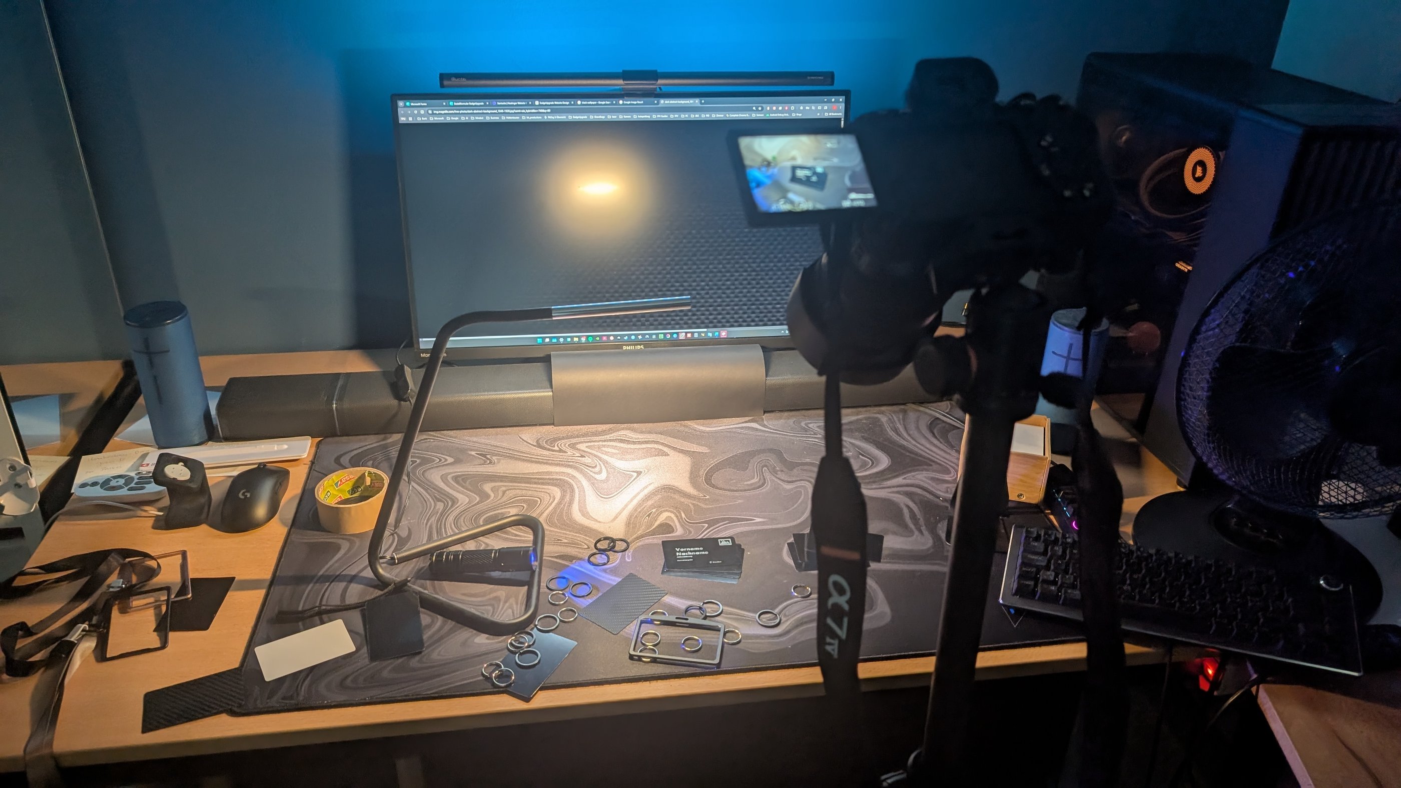 Professional desk setup with a Sony mirrorless camera on a tripod for overhead video recording.