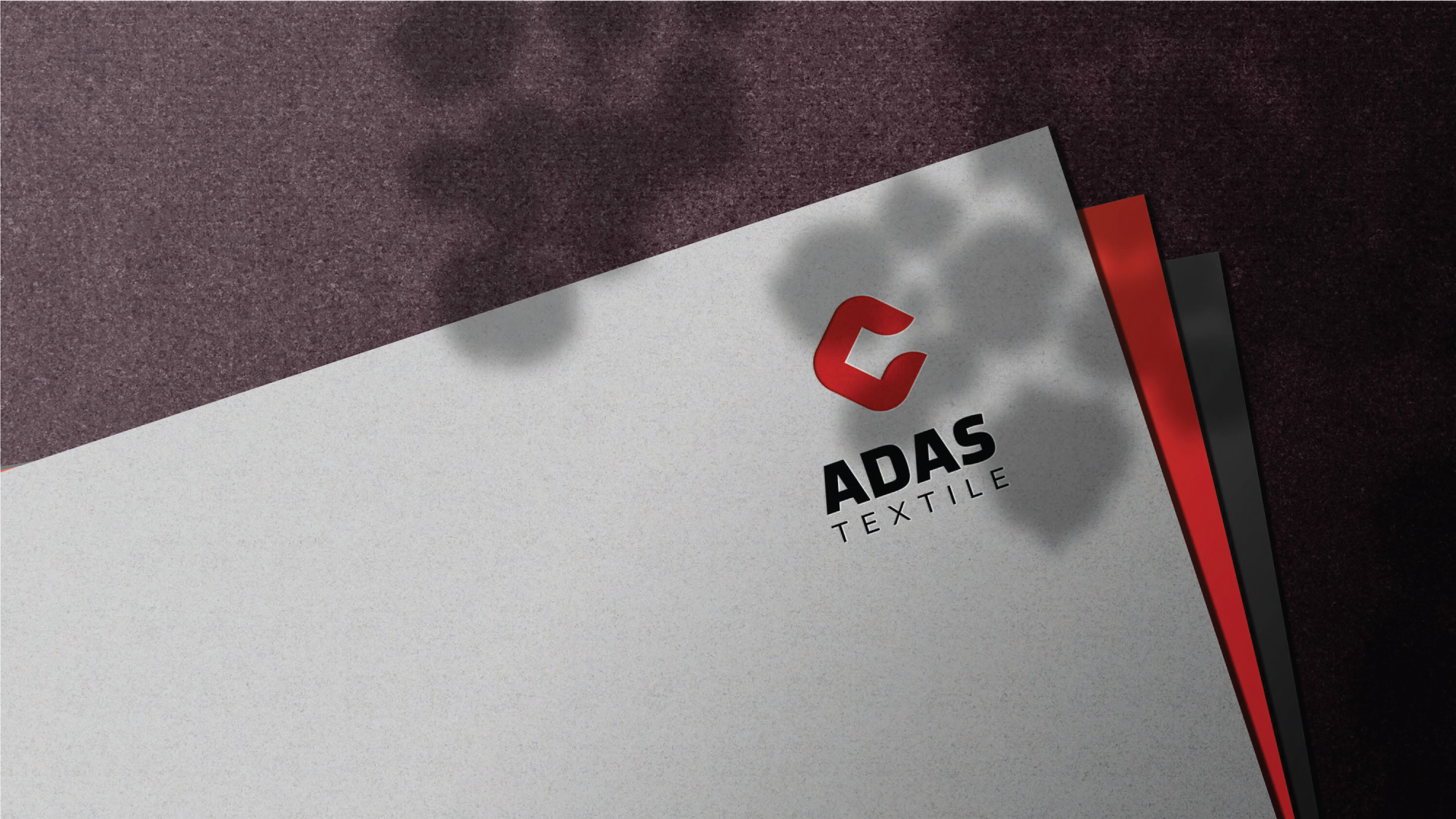 a close up of a business card with a red and white background