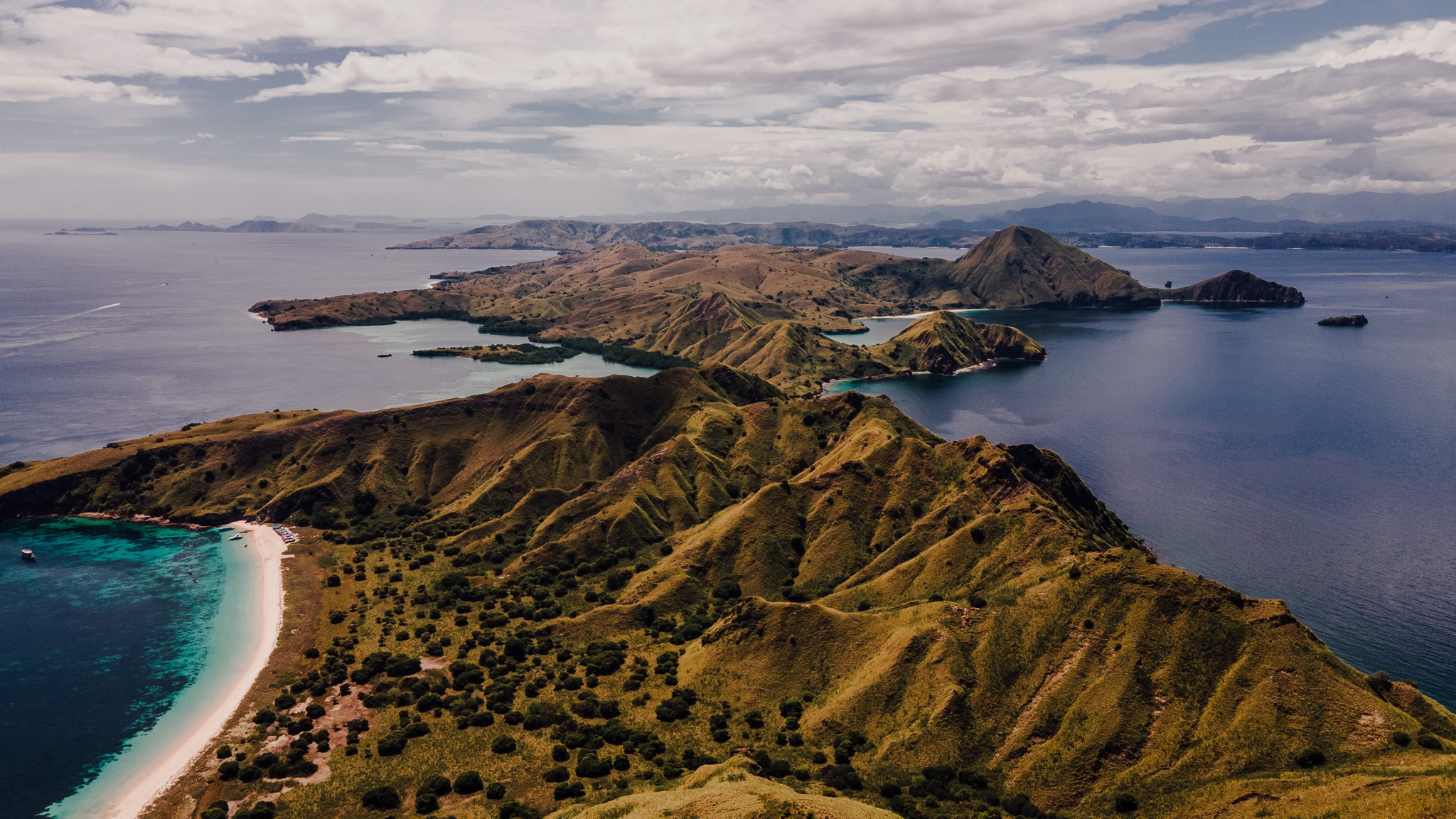 a view of a beach with a boat in the water