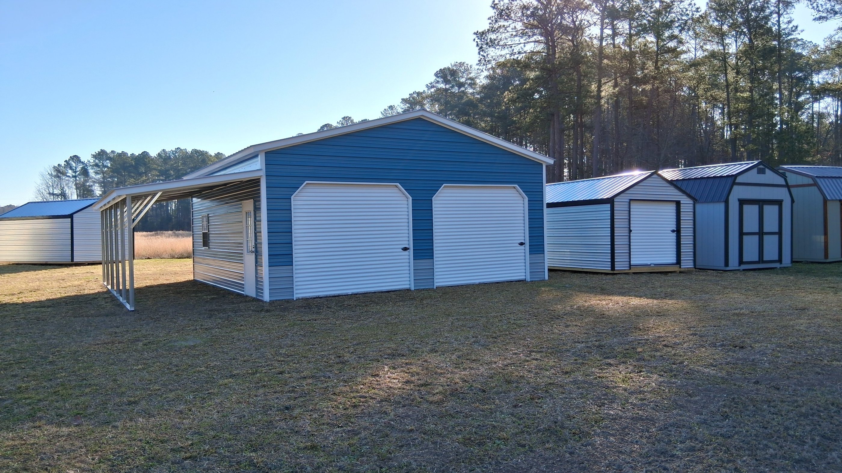 Custom-designed and Custom-built by Pine View Buildings of Moore County Blue Garage. 