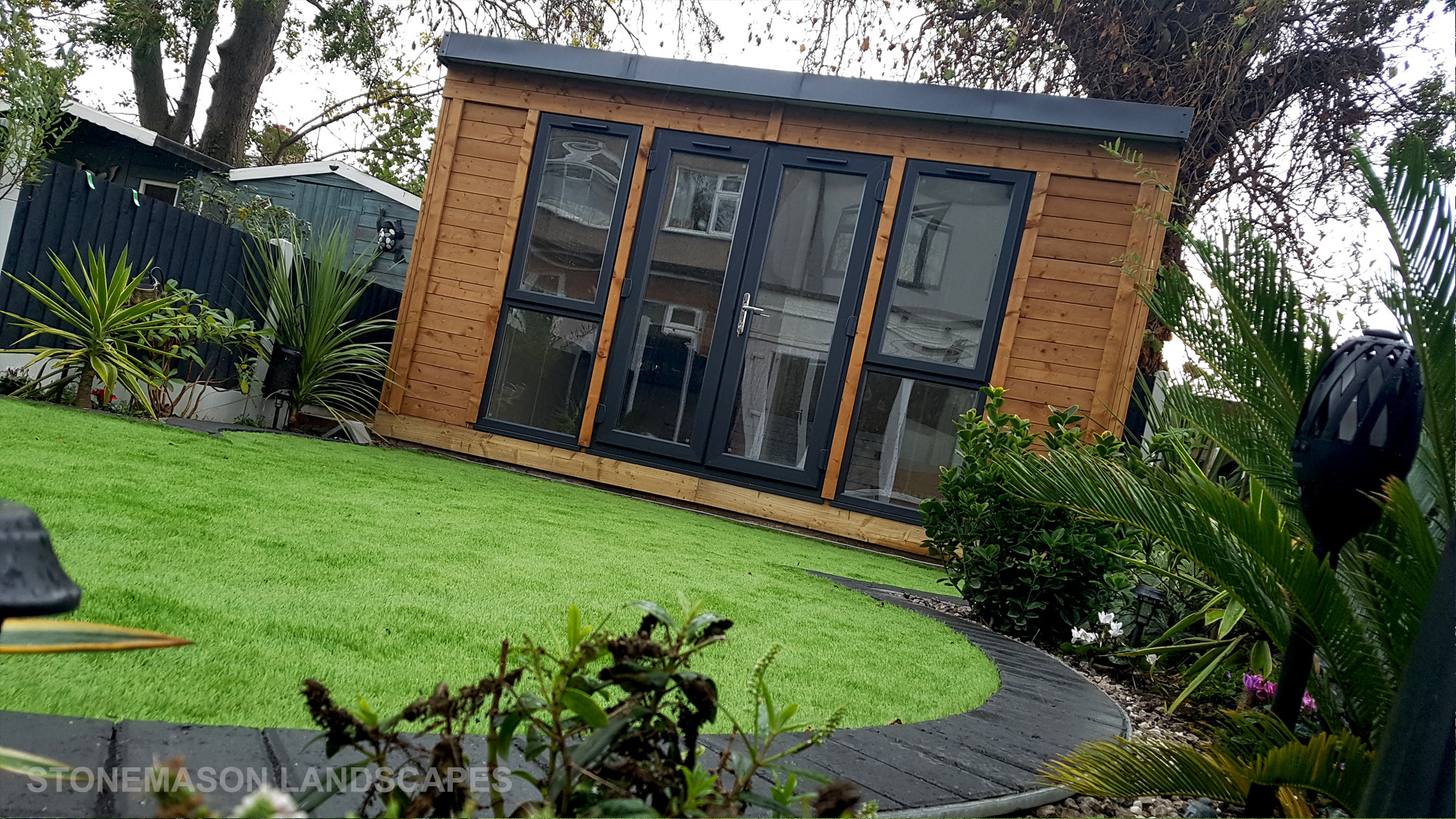 Exotic Modern Dynamic Designer Circle Lawn Tropical Small Garden