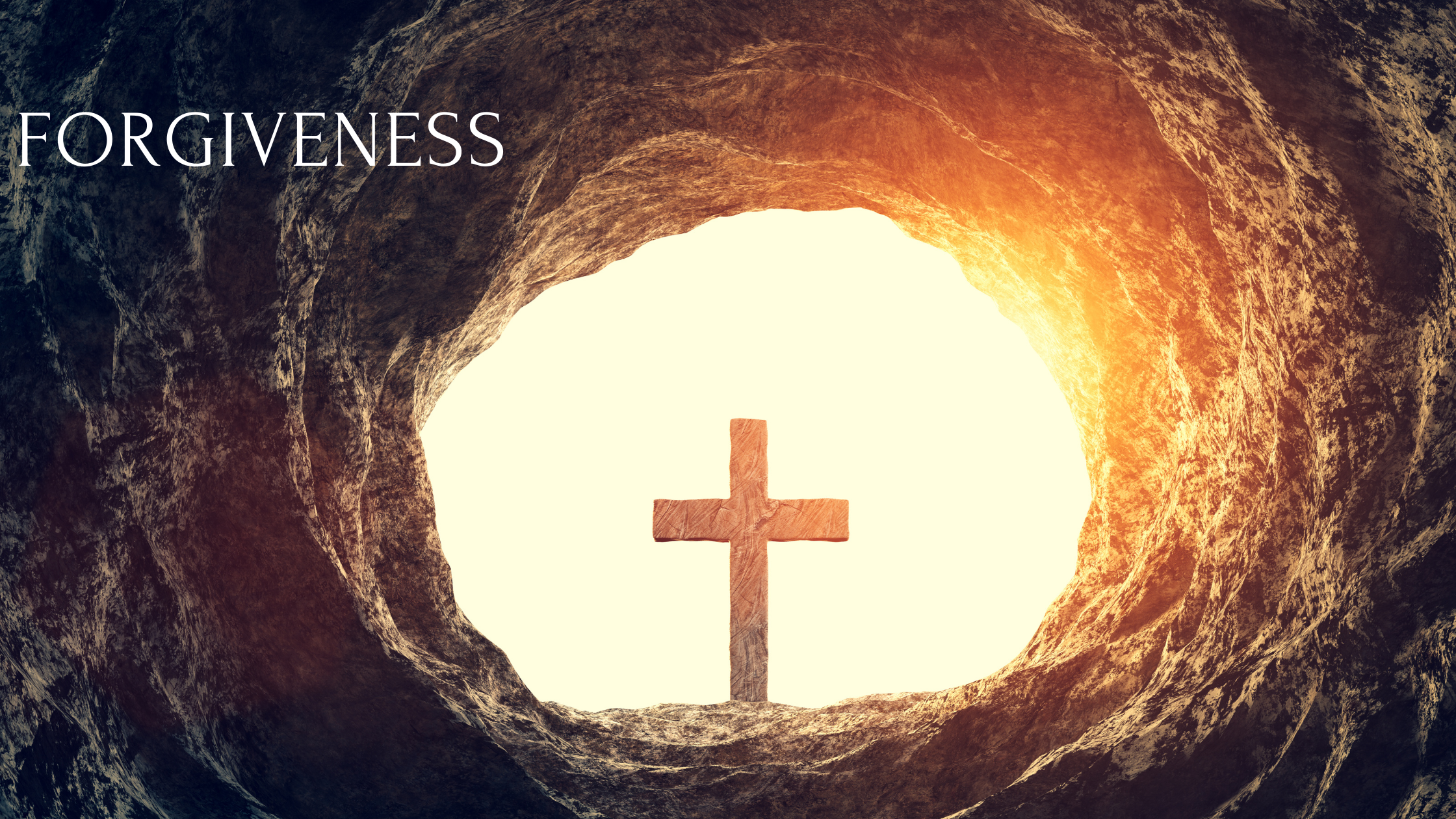 Wooden cross at the end of a tunnel backlit by sunshine with the word forgiveness in the foreground