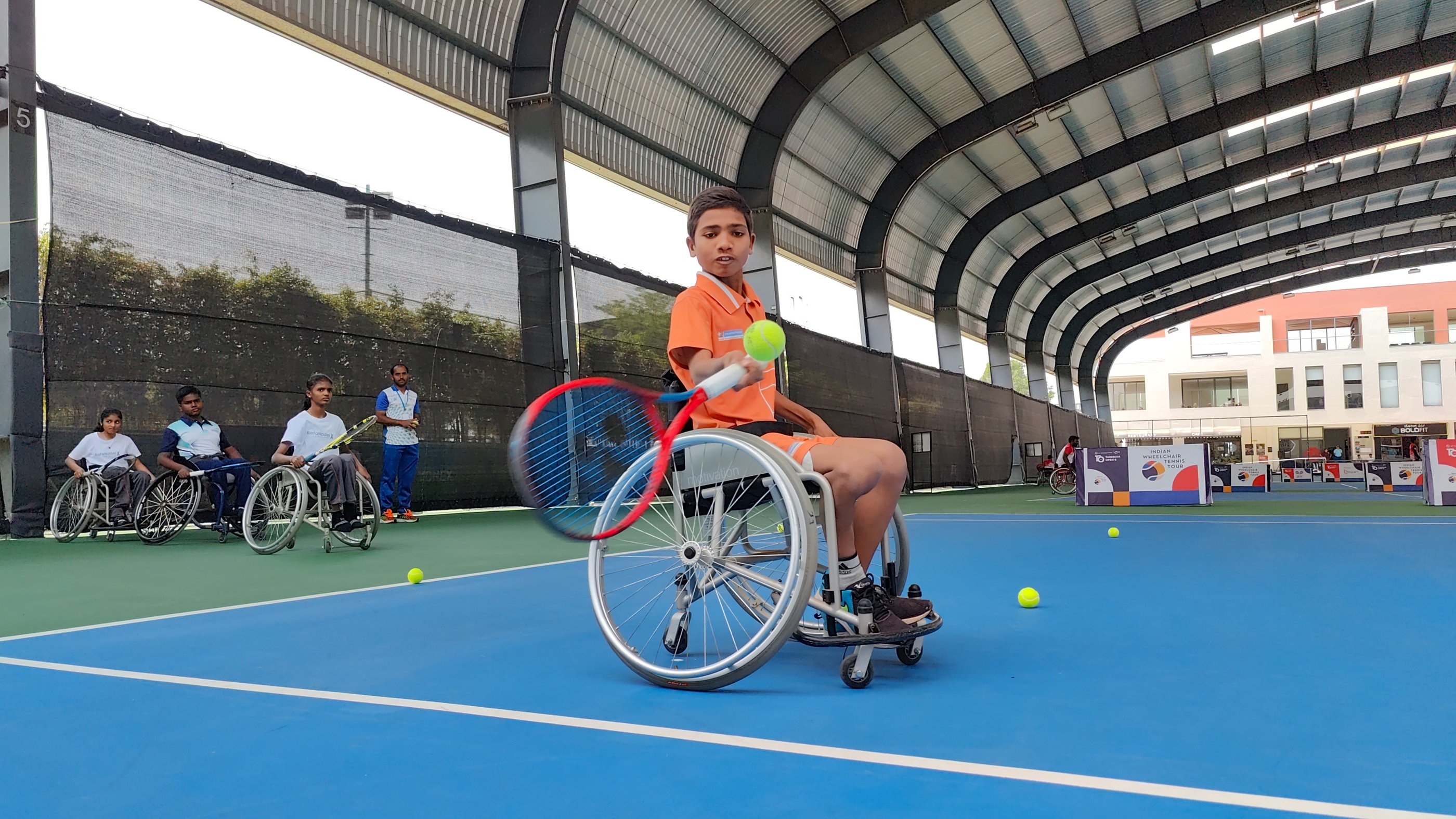 Wheelchair tennis player with Cesar Performance Coach