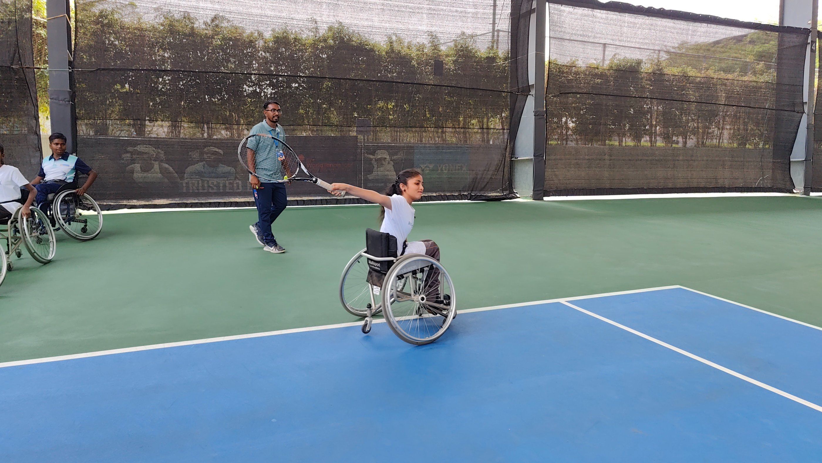 Wheelchair tennis player with Cesar Performance Coach