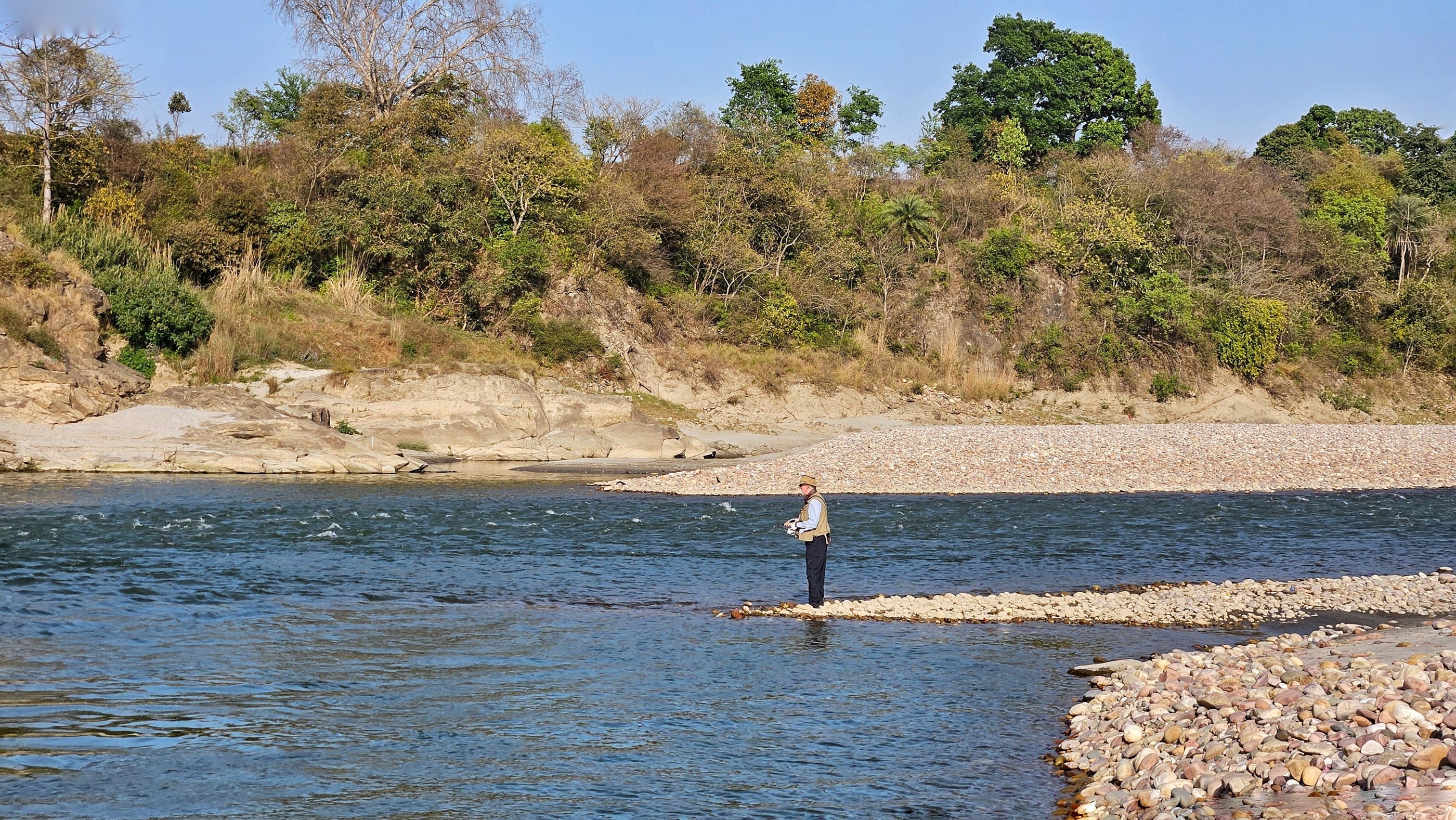 Fishing in a Himalayan river in Himachal Pradesh.