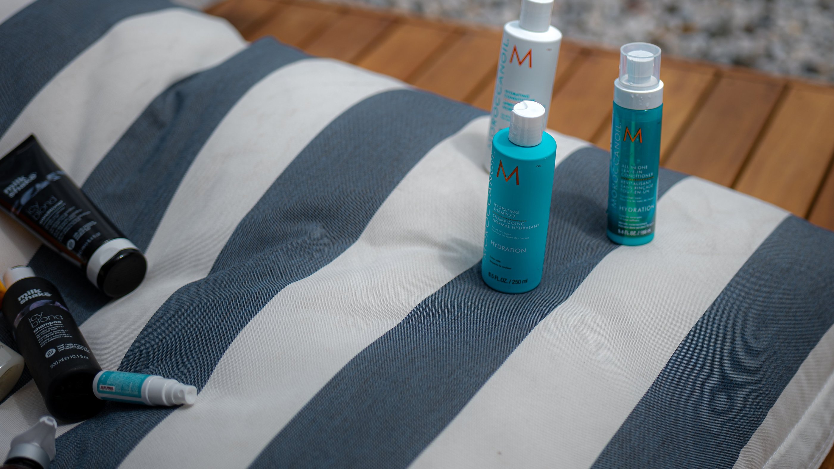 a group of three different types of hair products