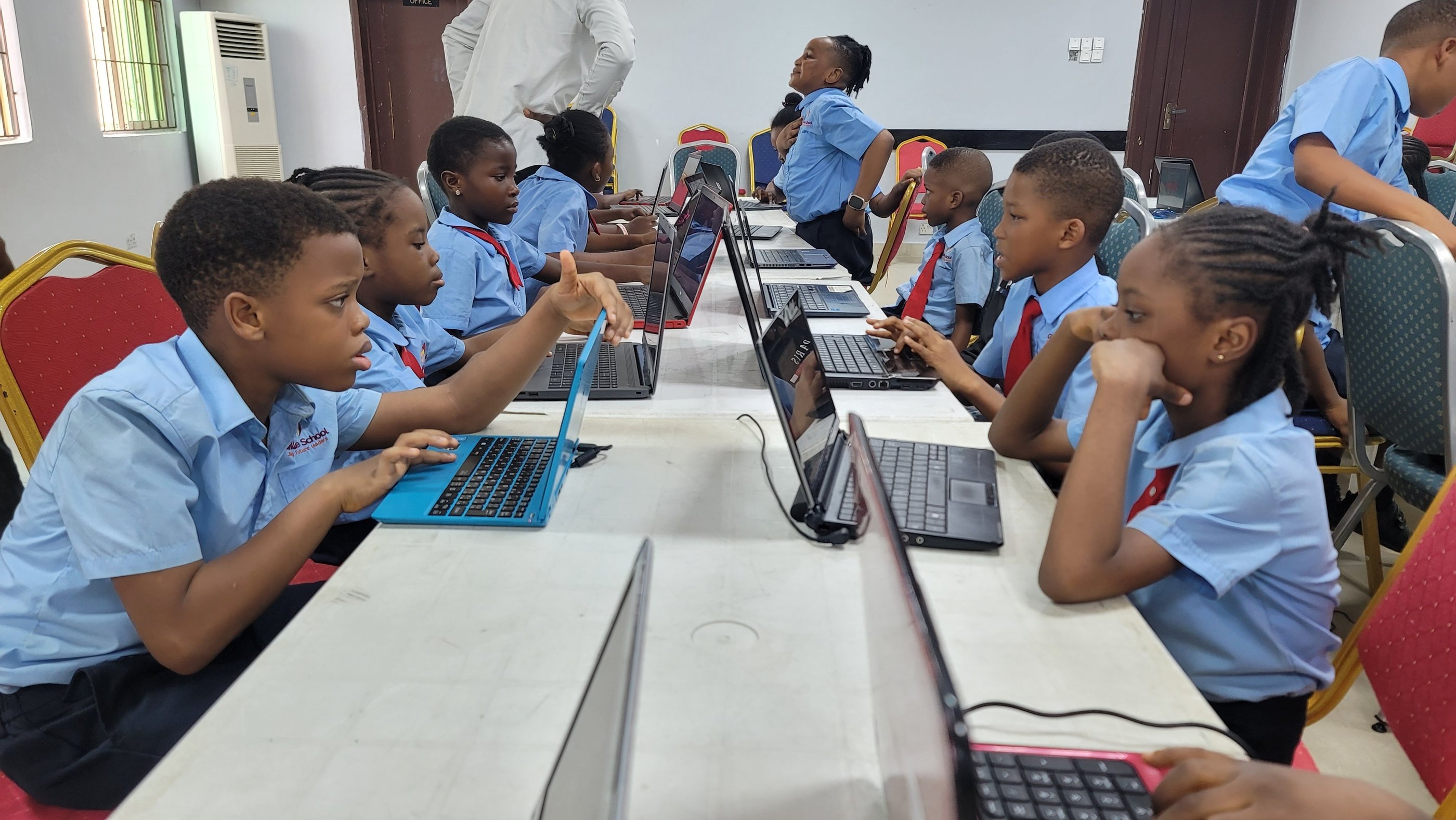 A group of pupils coding at school