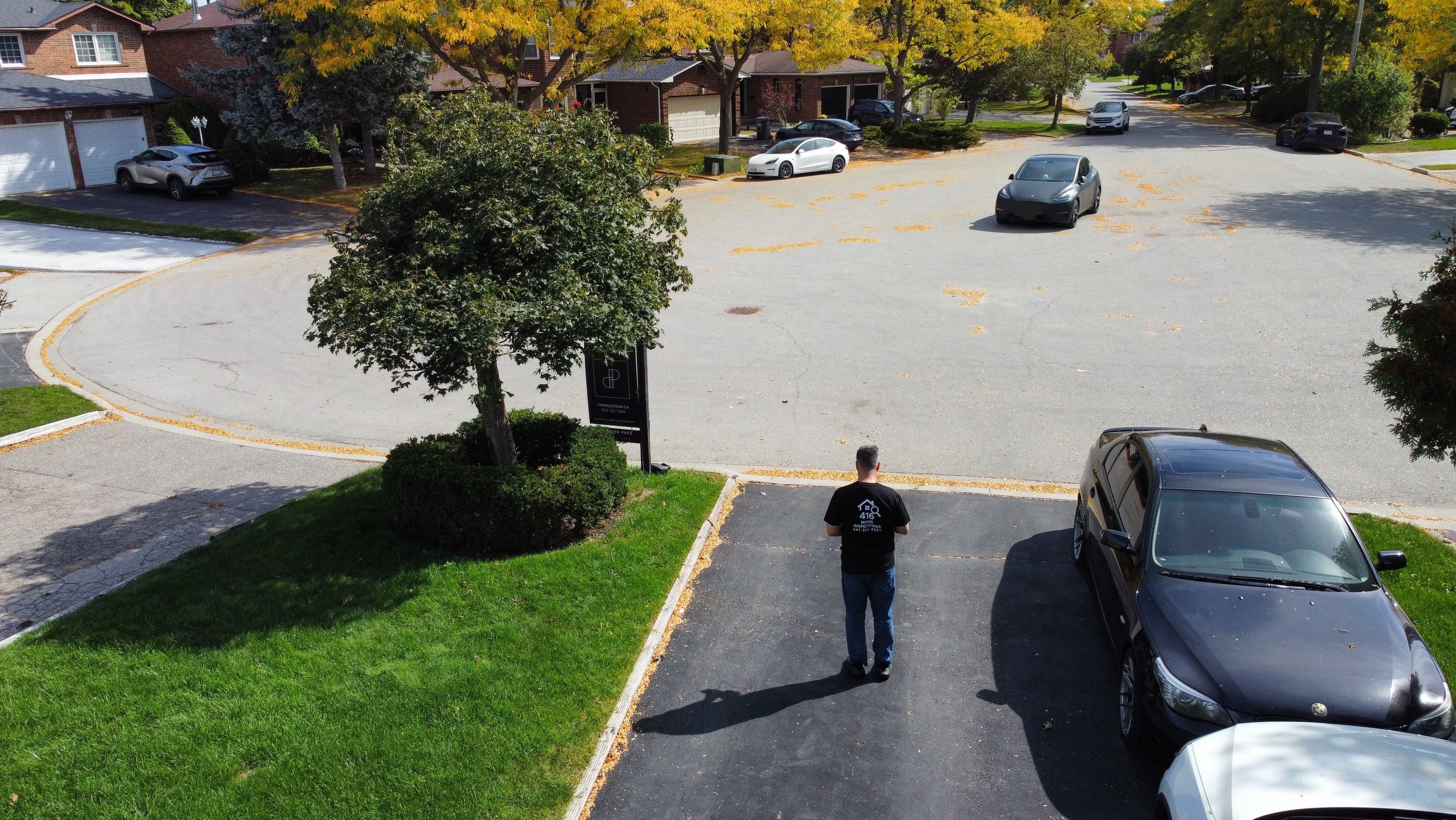 Drone driveway picture overlooking suburban housing
