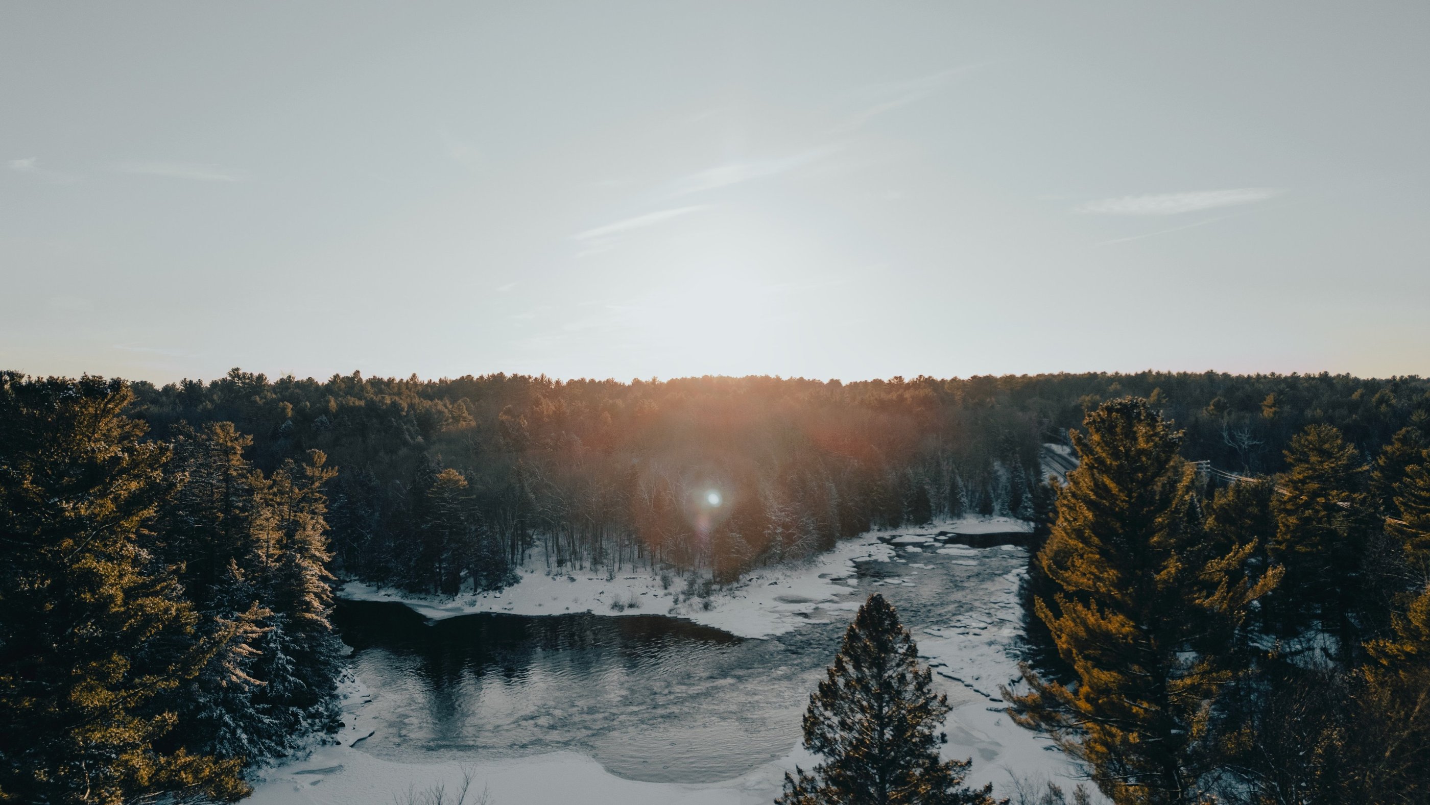 a river with a sun shining through the trees, Canada Nature