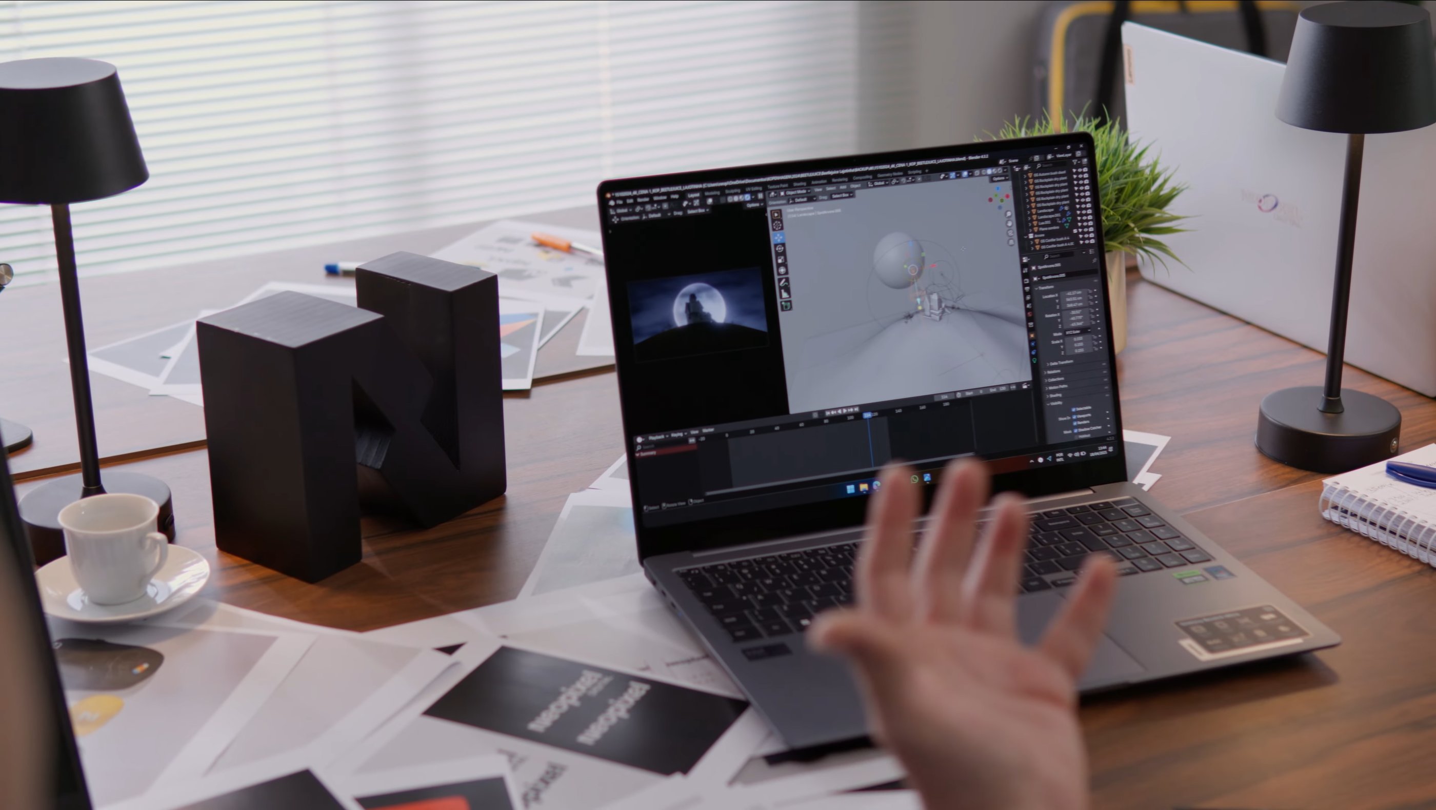 A person sitting at a desk with a laptop computer showing 3D animation software - Neopixel Digital