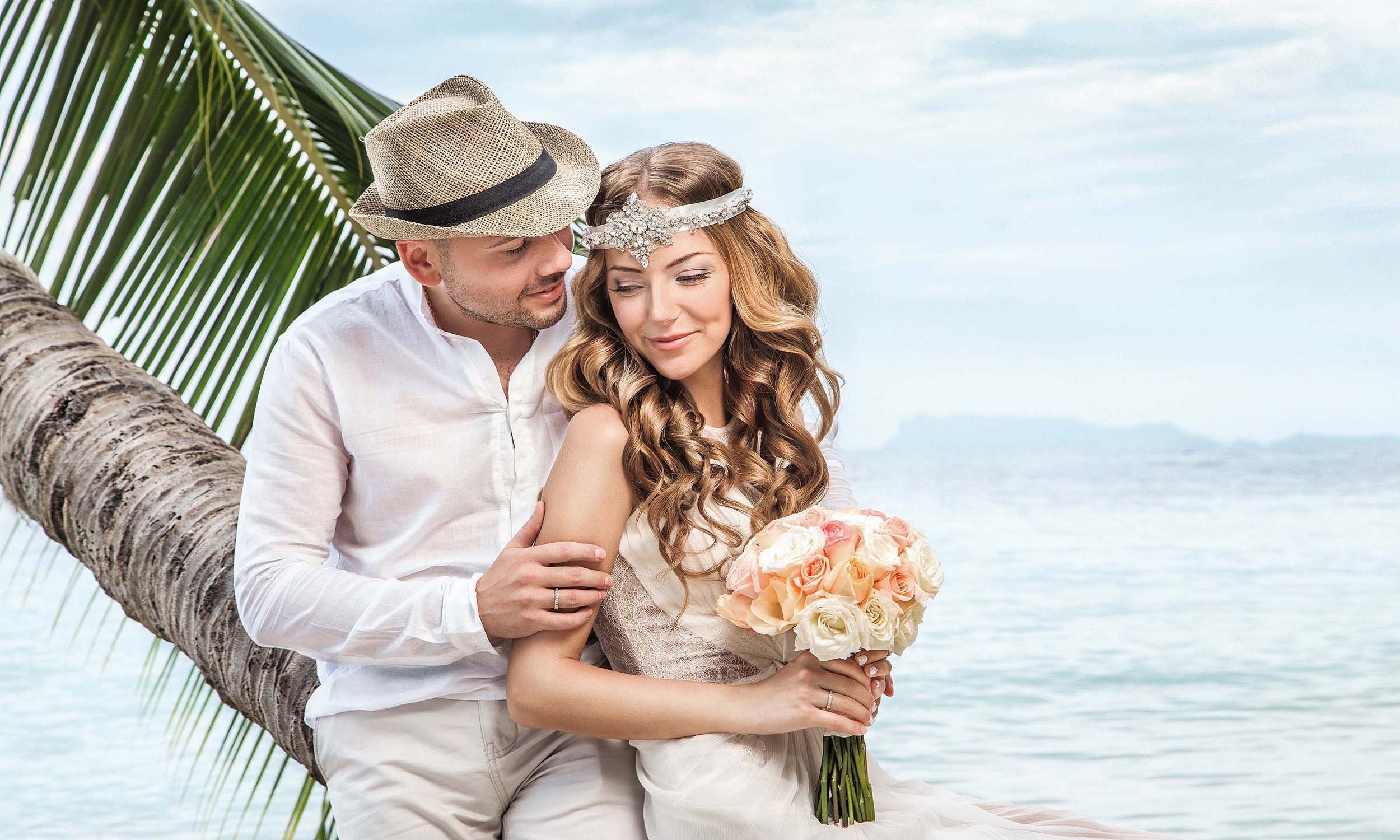 Romantic wedding photo shoot on a tropical island beach in Thailand.
