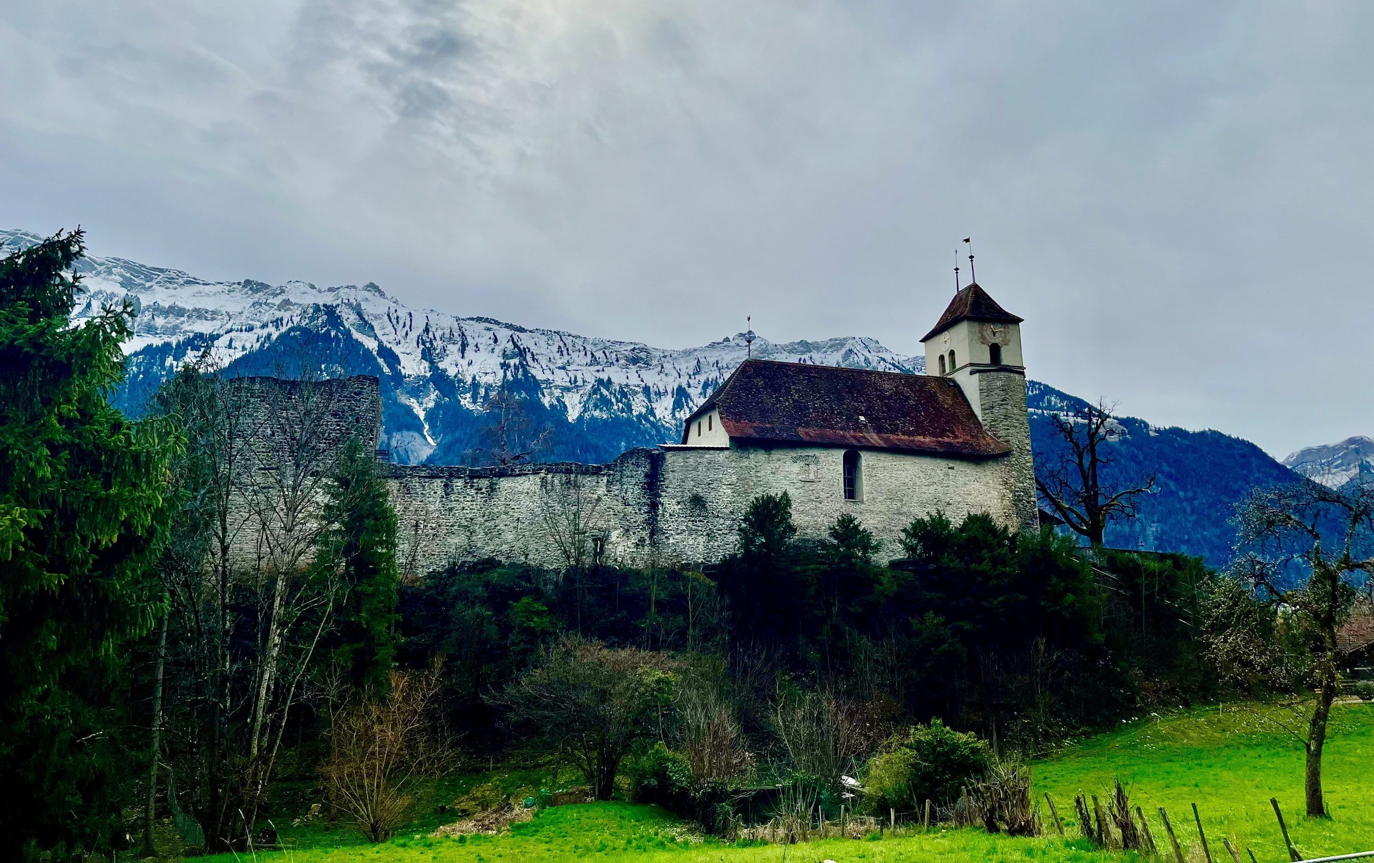 Looking up at Riggenberg Church and castle in Ringgenberg Switzerland outside of Interlaken