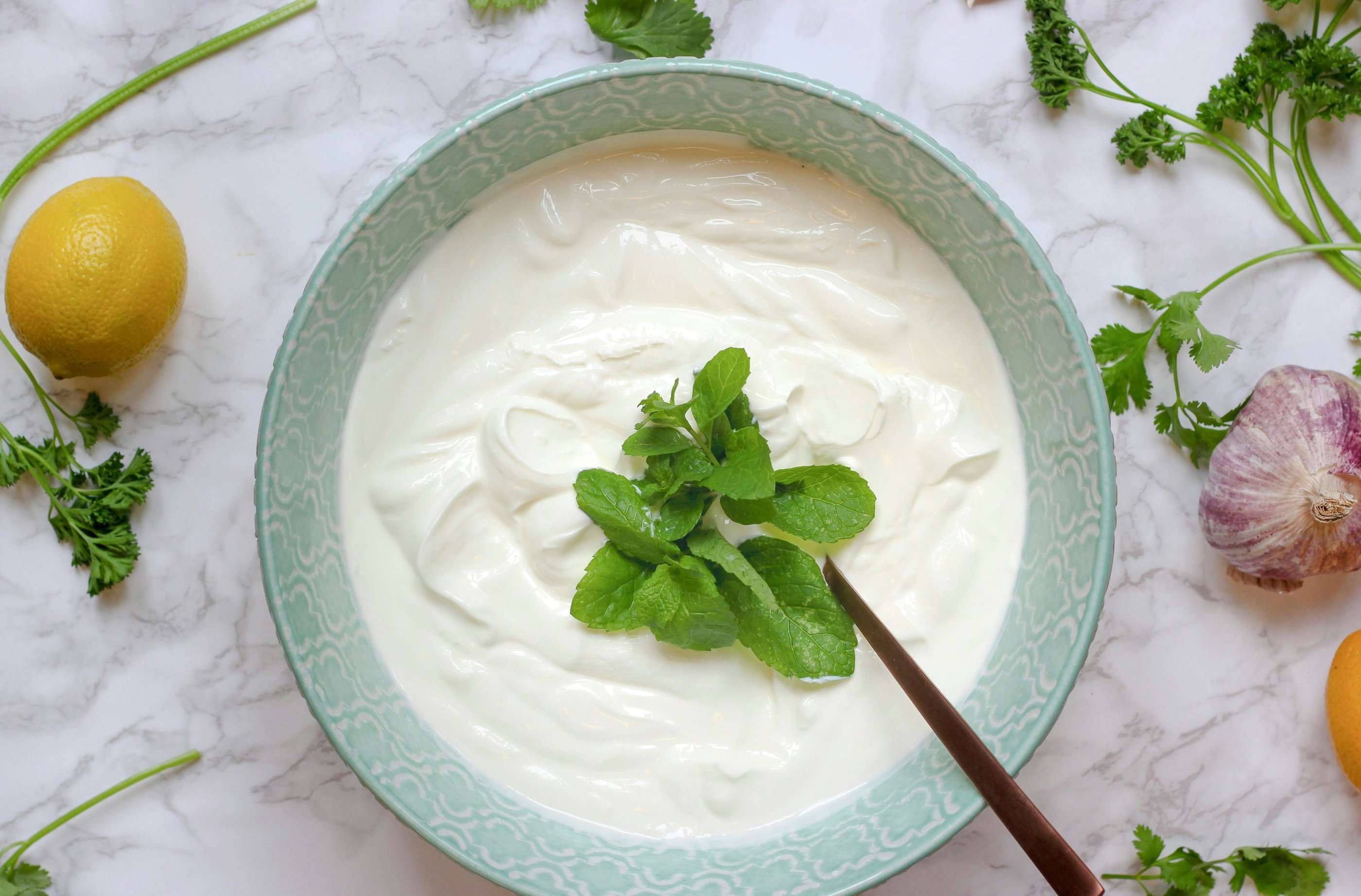 bowl of natural yoghurt with mint