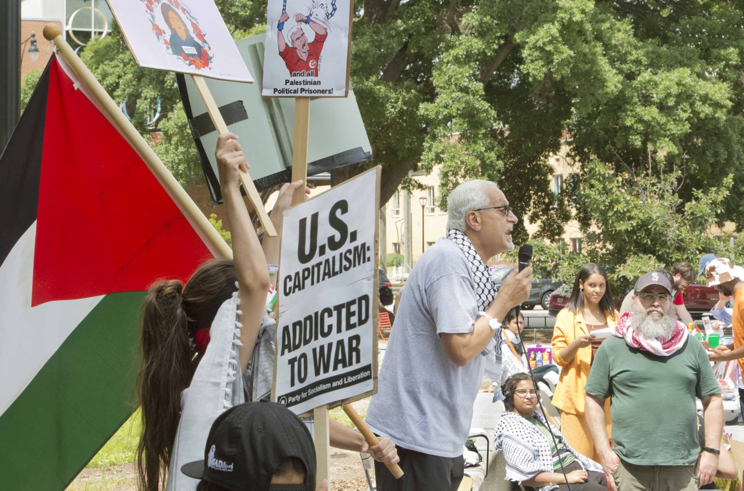 Burhan Ghanayem speaks passionately to a crowd at a protest