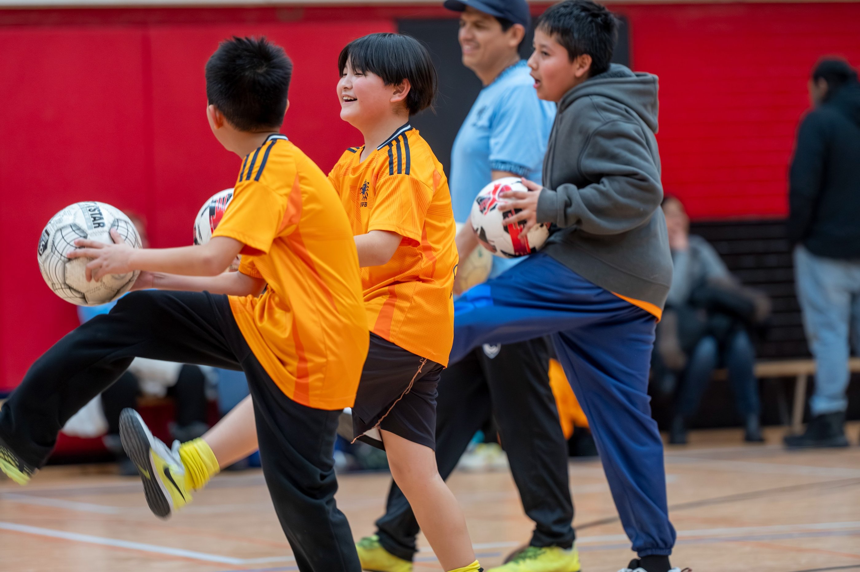 MVB FC students practicing soccer ball control drills during an indoor Soccer School in Mississauga