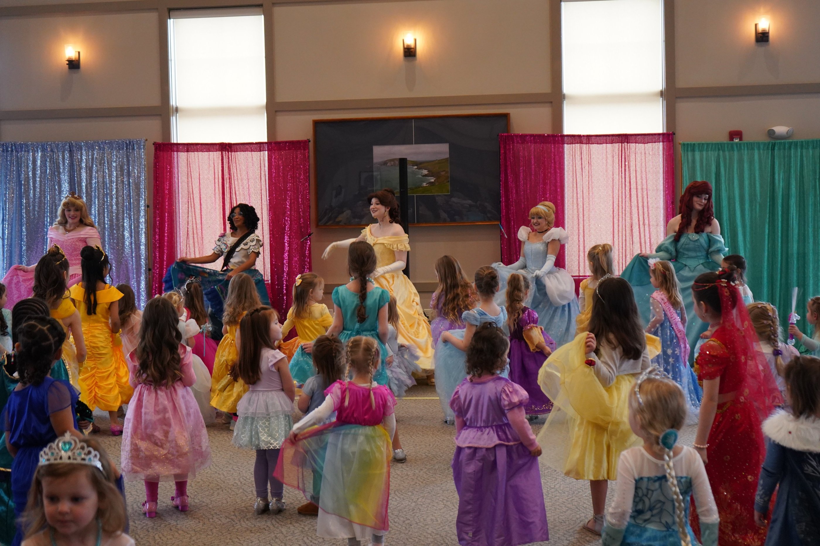 Princesses perform a dance at a ball