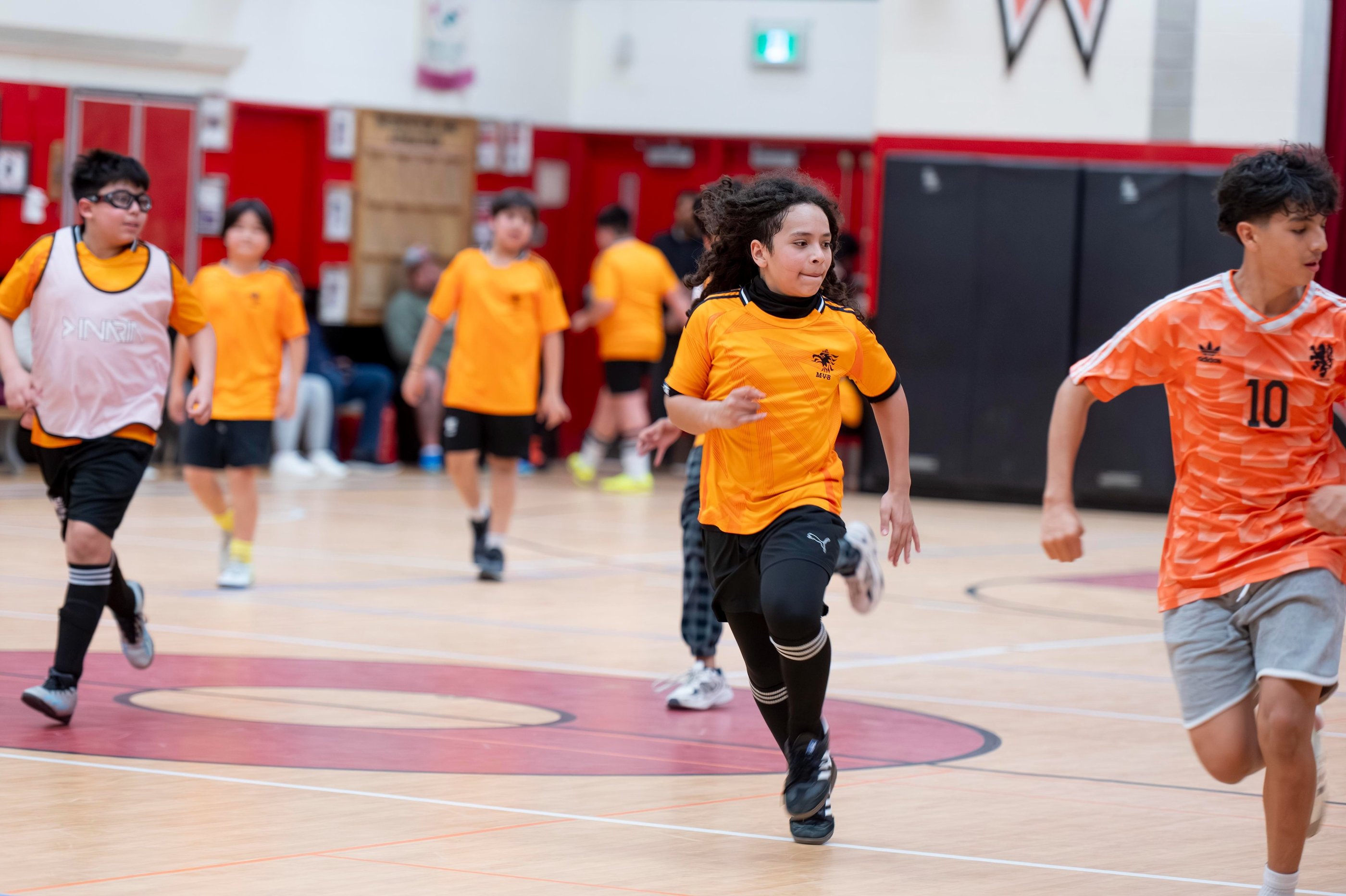 Young soccer players in a competitive indoor soccer game MVB FC Soccer School in Mississauga