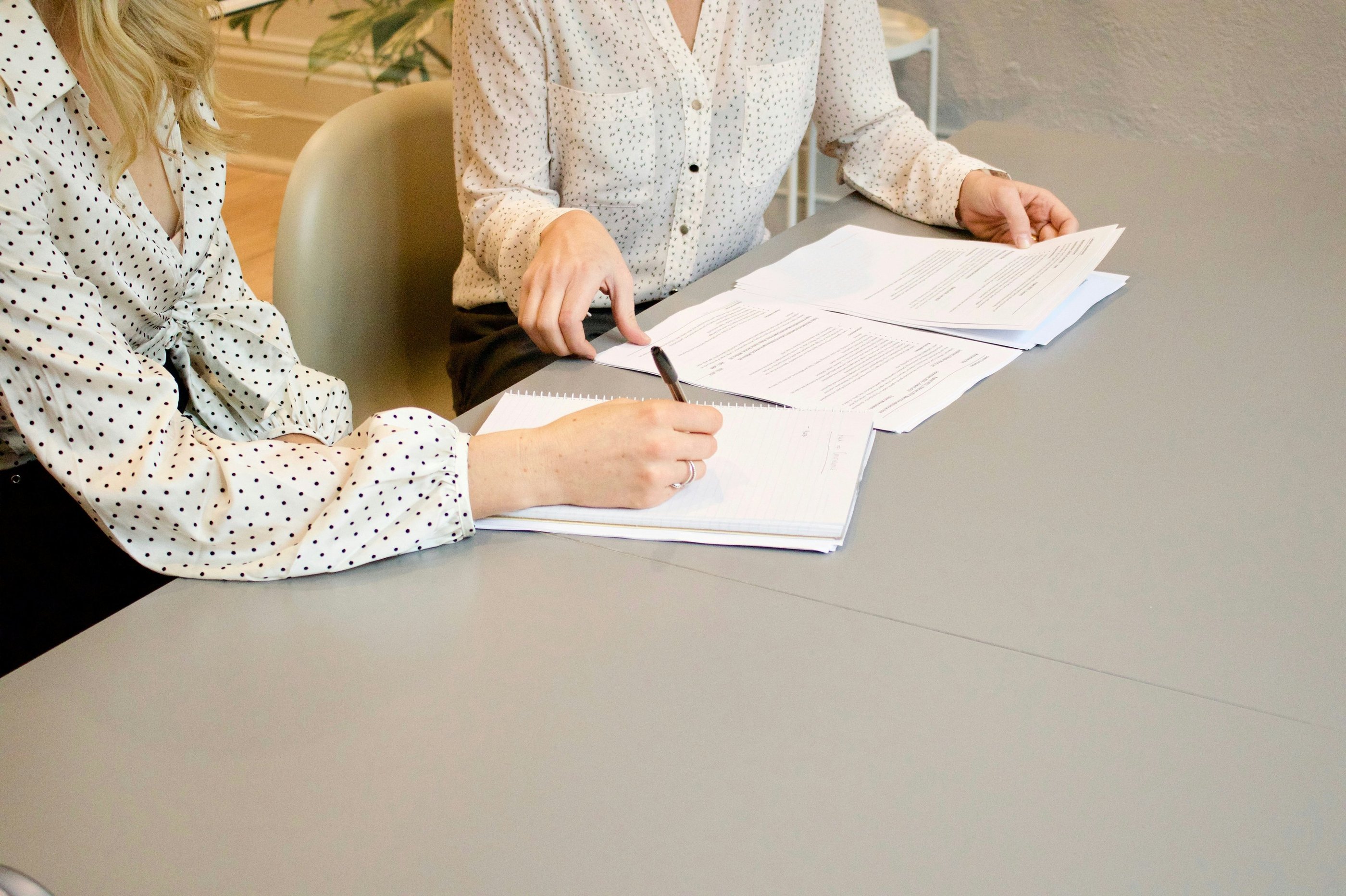 Two women sitting in a consulting and having in conversation in nutritional advice.