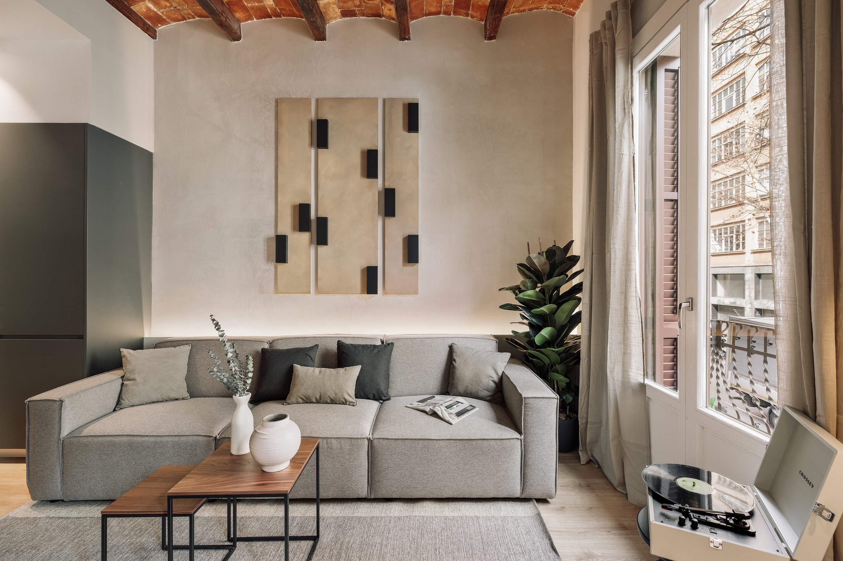 Contemporary Living room with custom art panels, minimalist furniture, neutral tones interior design