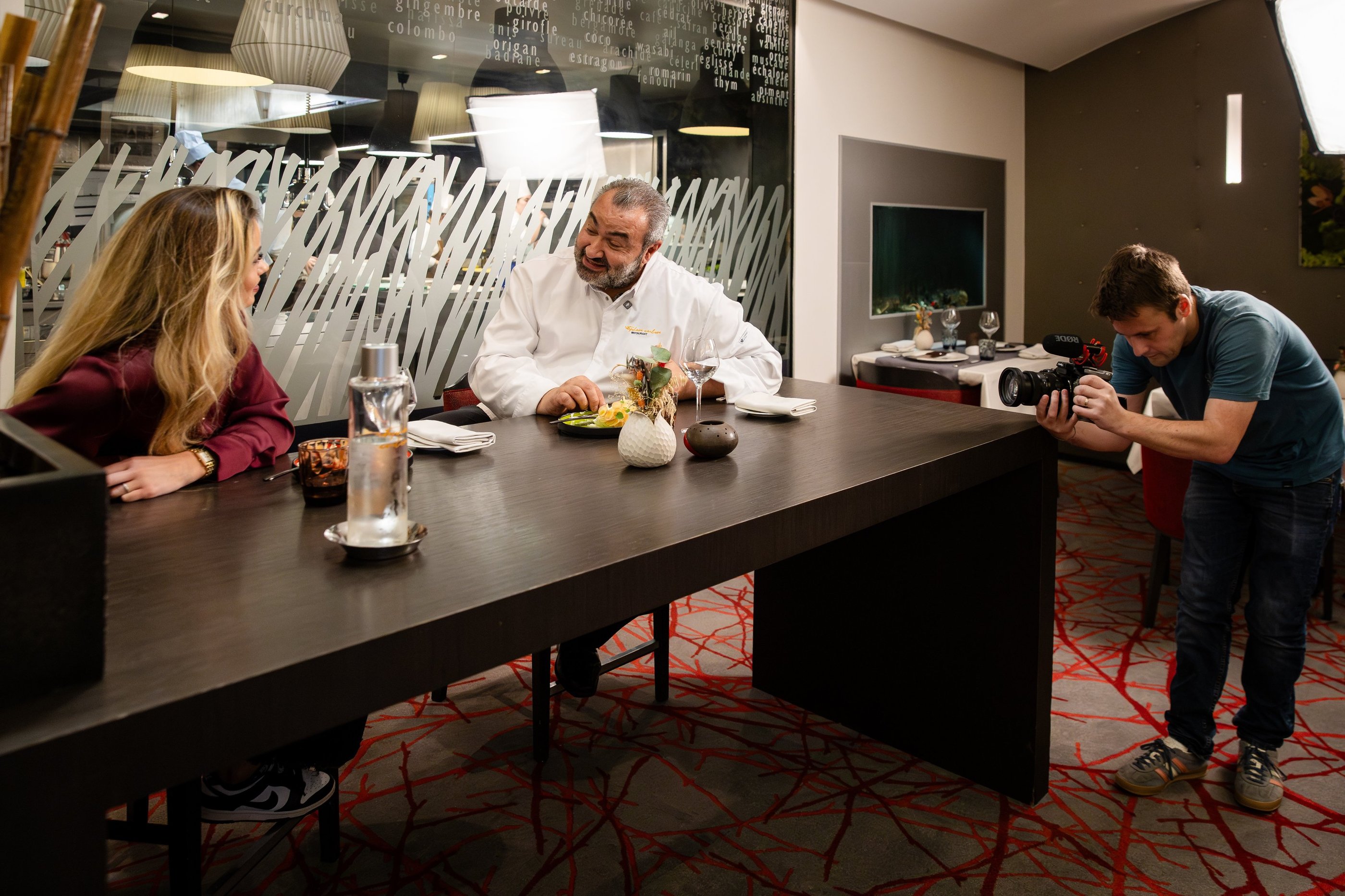 a man and woman are sitting at a table