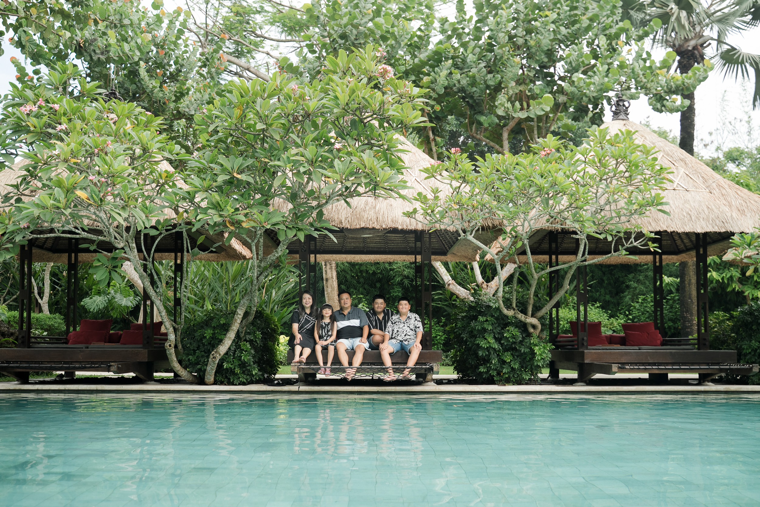 tropical poolside view at Movenpick Jimbaran Bali showing a calm setting for family photography sessions