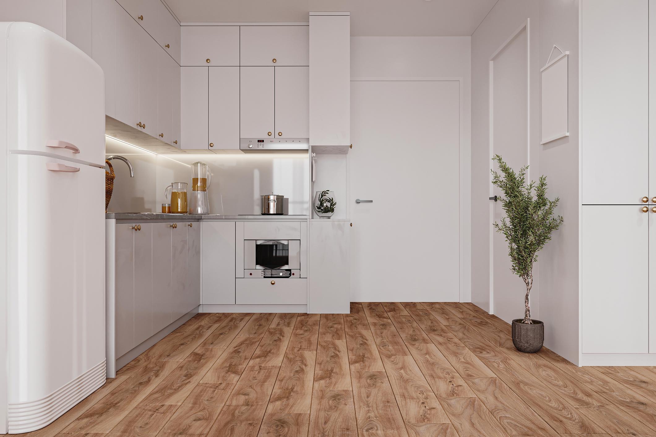 Modern kitchen with durable luxury vinyl plank flooring designed for moisture-prone spaces.