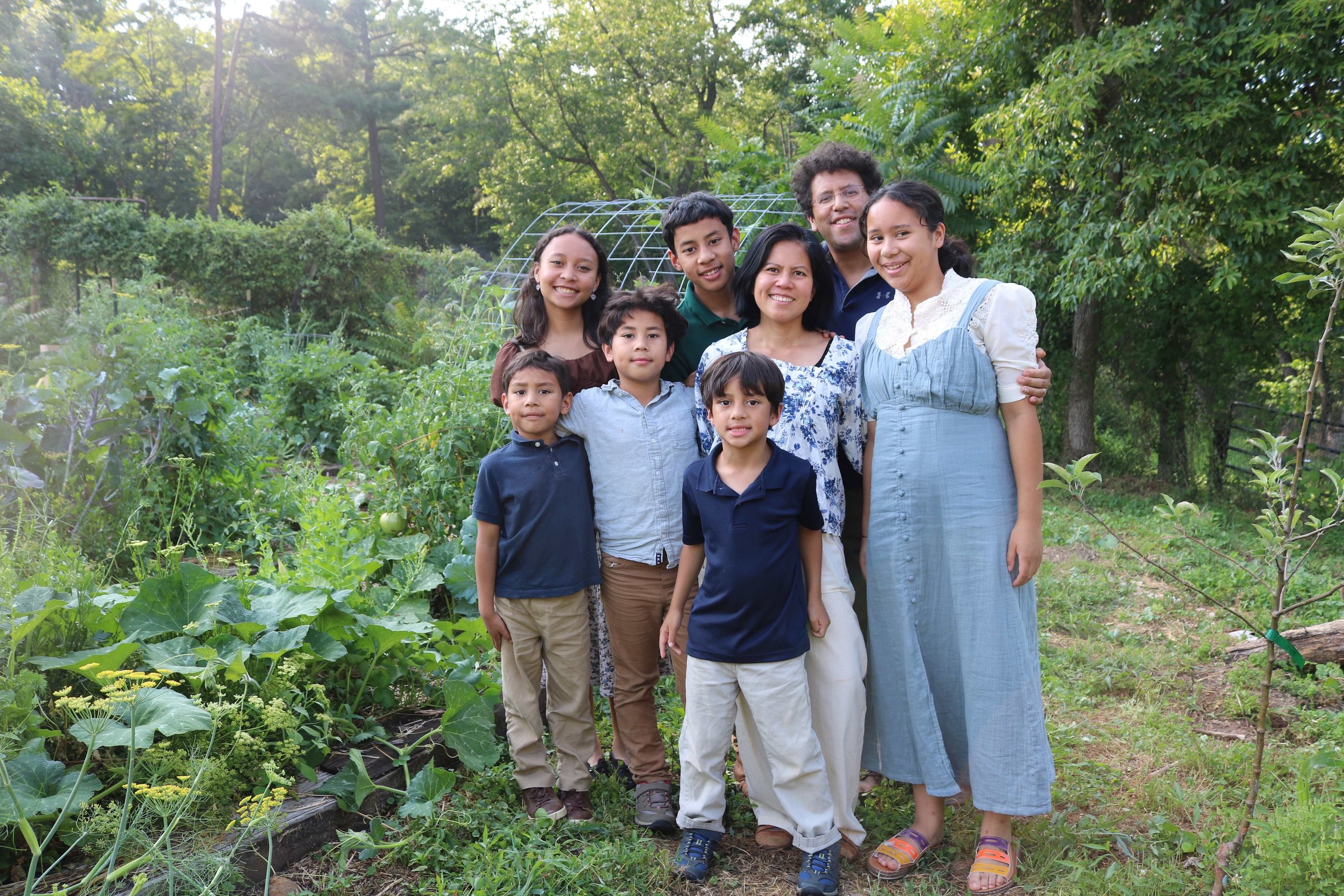 The Schauder Family in front of their garden. 