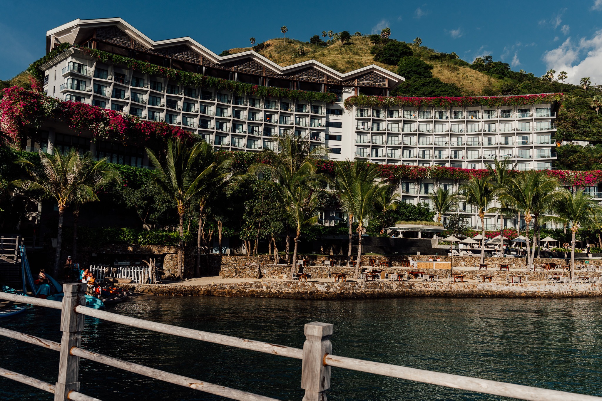 a large building with a boat in the water