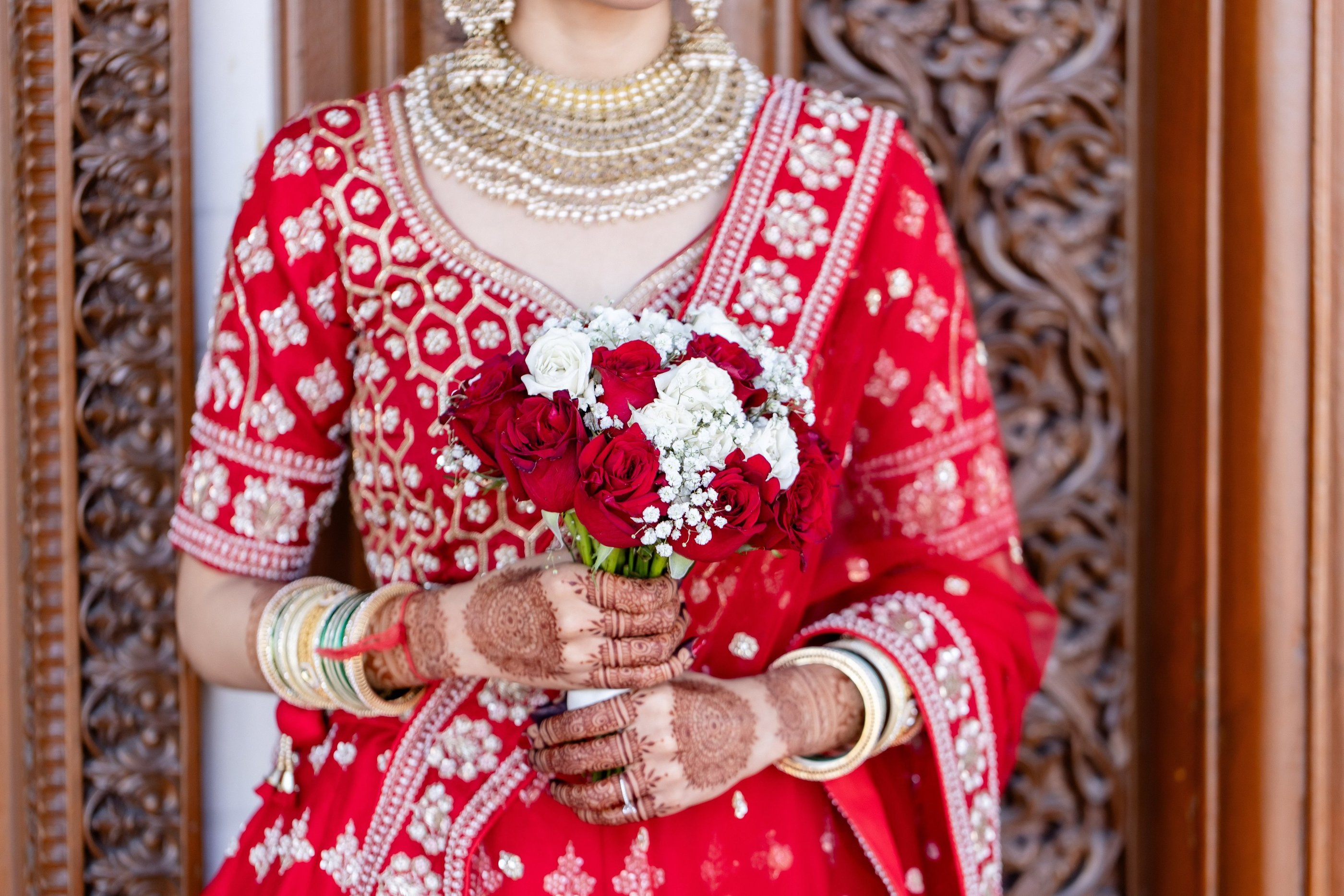 Beautiful Bride is Holding Flower in Hand