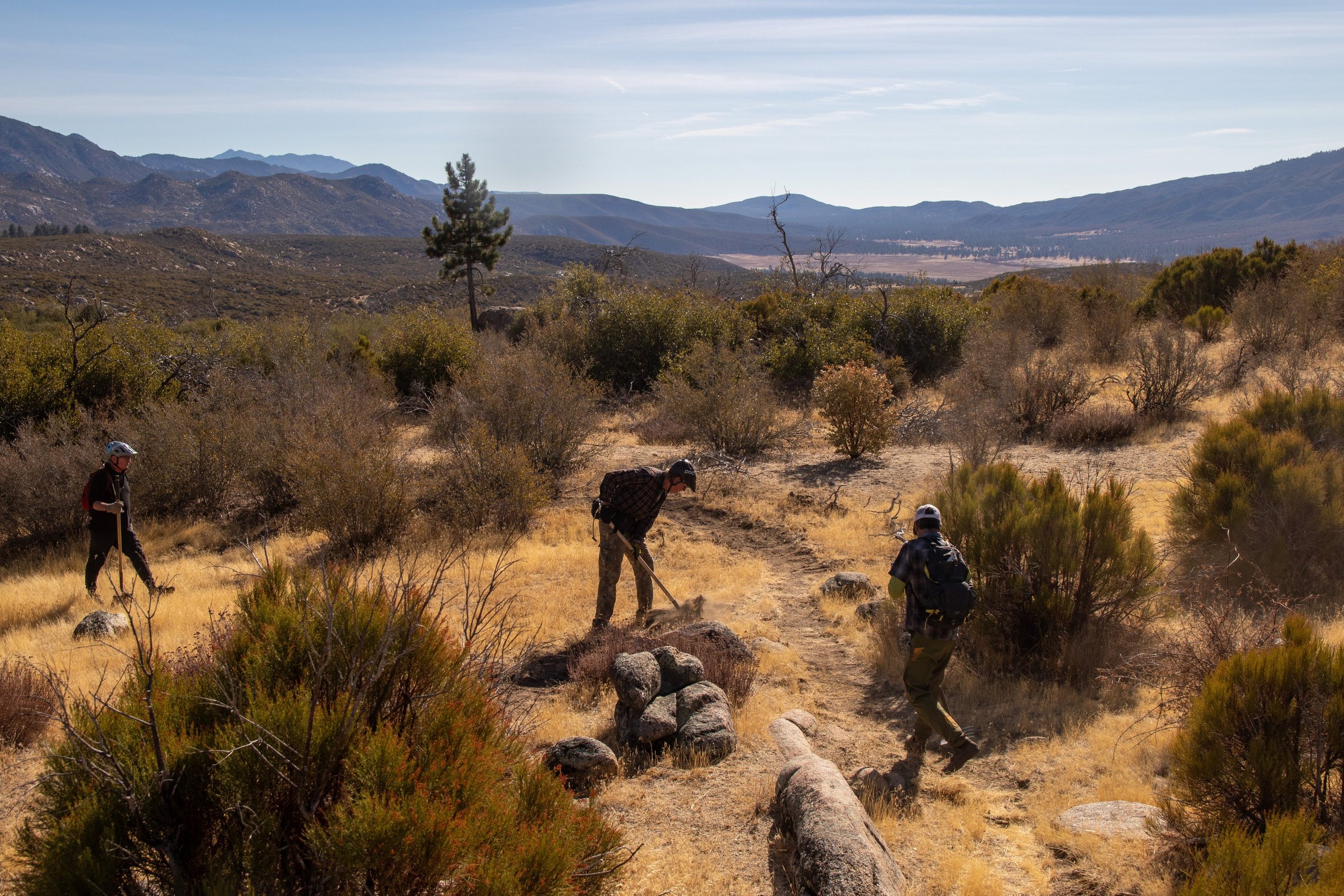 a group of people walking on a trail