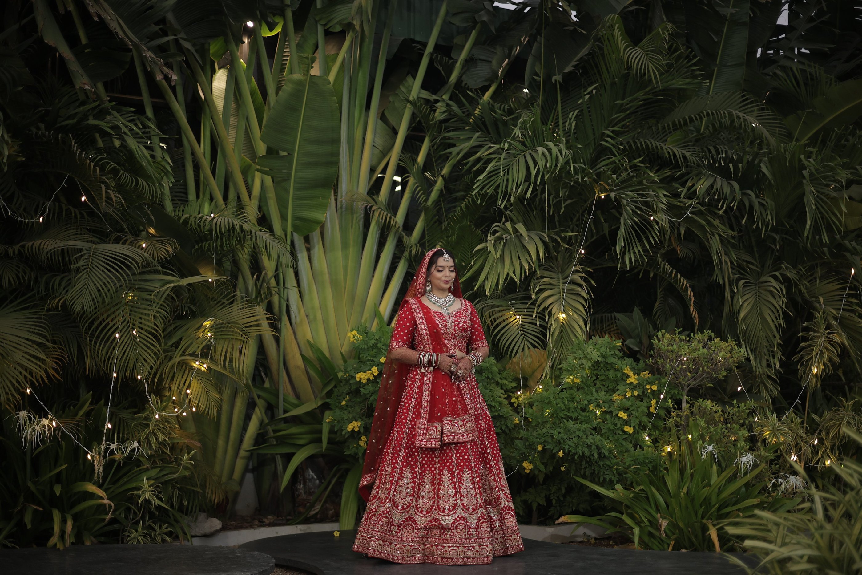 Gujarati bride red lehenga bridal makeup Vadodara, destination wedding and party plot reception brid