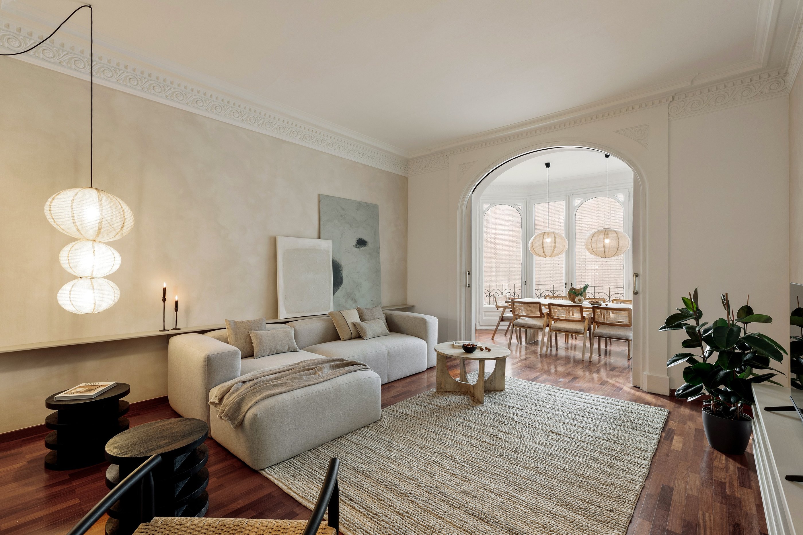 Sophisticated Living room with modern decor, natural materials, and a neutral color palette and art